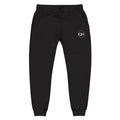 Black jogger pants with Courageous Nation CN logo on a white background
