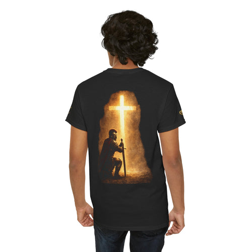 Person wearing a black t-shirt with a graphic design on the back, standing against a white background.